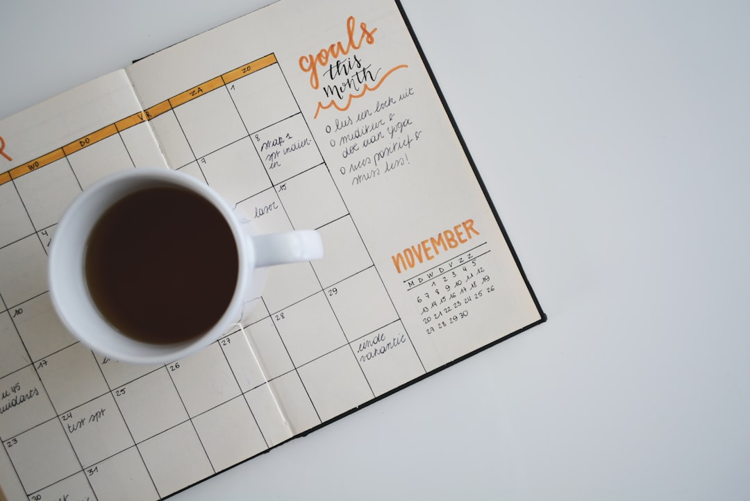 A planner and coffee — the quiet ritual of daily systems.