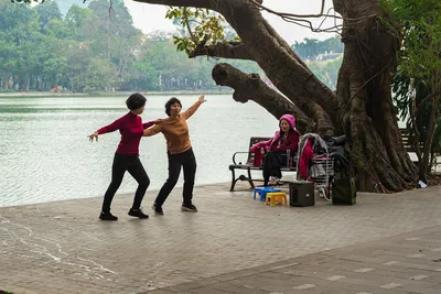 Women dancing by a lake showing vitality - Photo by Khanh Do on Unsplash