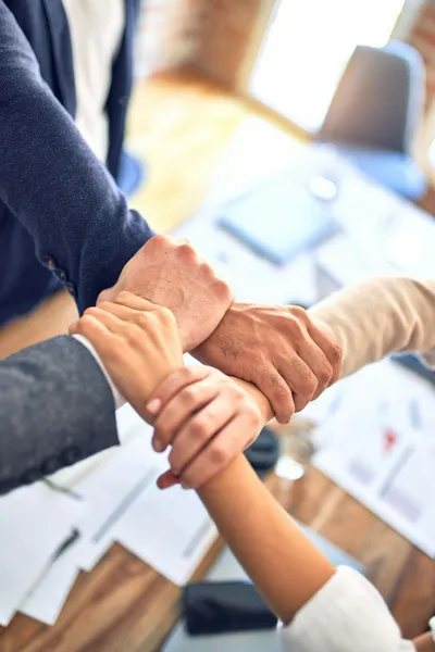 Business team with hands together - Photo by krakenimages on Unsplash