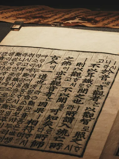 Ancient calligraphy on aged paper - Photo by YMA on Unsplash