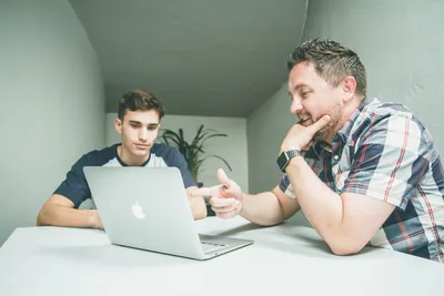 A mentor guiding a young person forward — Photo by Quilia on Unsplash