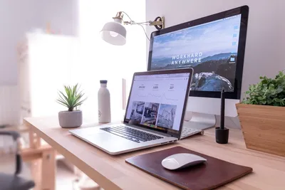 Clean workspace with MacBook - Photo by Domenico Loia on Unsplash