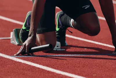 Athlete running on track - Photo by Braden Collum on Unsplash