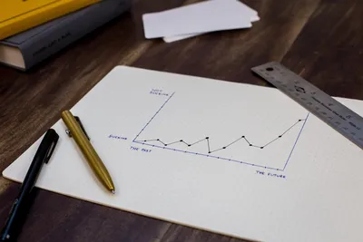 Charting goals with pen and paper - Photo by Isaac Smith on Unsplash