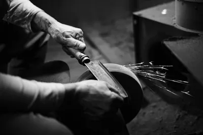 Craftsman working on wood — Photo by Bailey Alexander on Unsplash