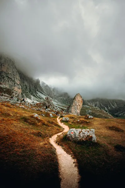 Mountain path in the mist — Photo by Daniel J. Schwarz on Unsplash