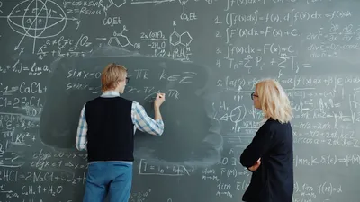 Student and teacher at a blackboard — Photo by Vitaly Gariev on Unsplash
