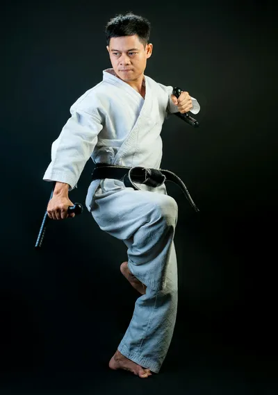 Martial artist standing in discipline — Photo by Thao LEE on Unsplash