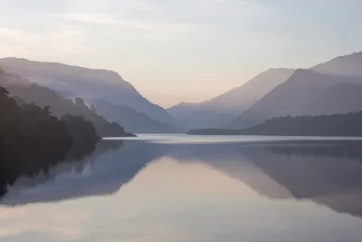 Still lake reflection with mountains — Photo by Neil Mark Thomas on Unsplash