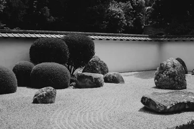 Photo by Content Pixie on Unsplash A zen rock garden in black and white, representing ongoing awareness and the mind that remains