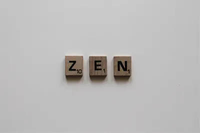 Photo by Amanda Jones on Unsplash A minimalist zen arrangement with natural elements, representing emptiness, strategy, and leaving no openings